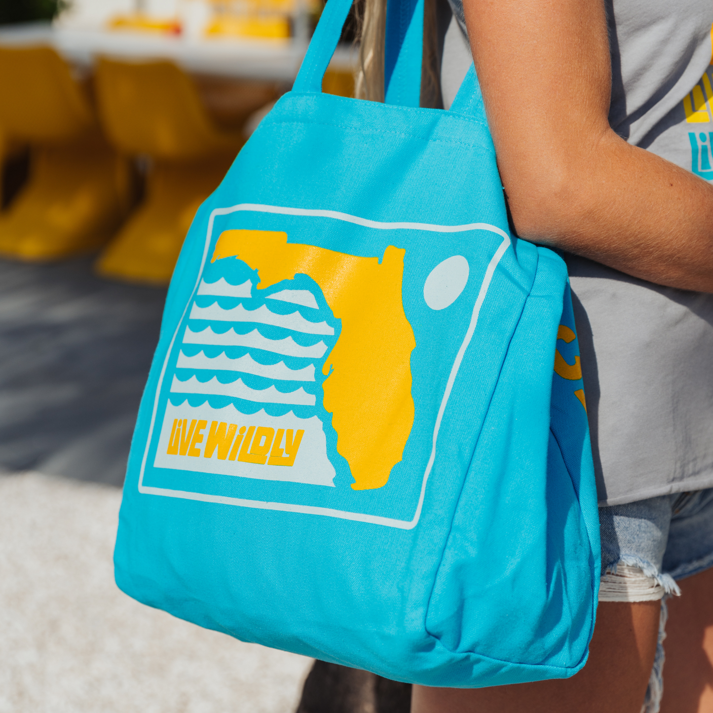 Live Wildly Florida Reusable Tote Bag – Pool Blue Canvas - Over Shoulder Zoomed - Live Wildly
