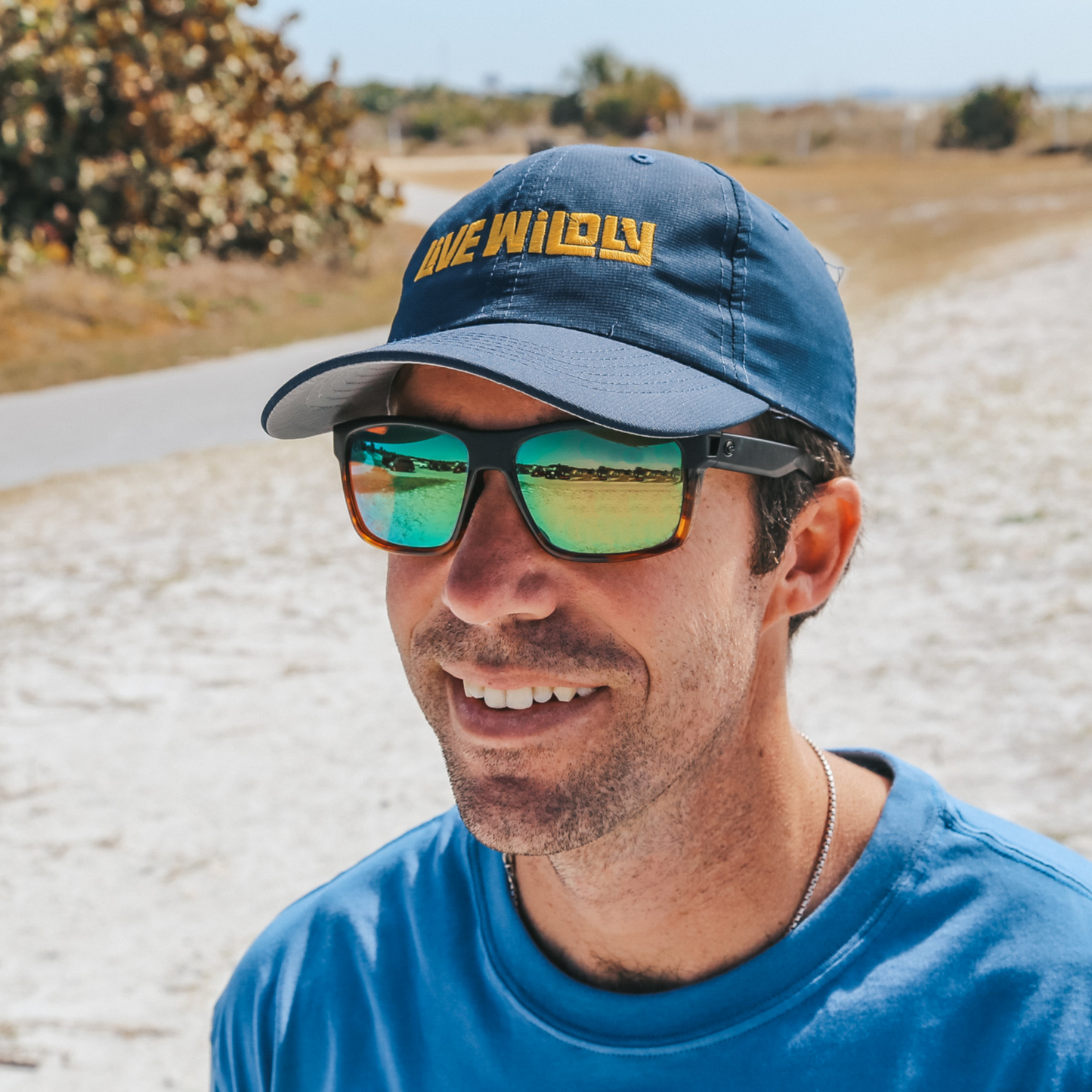 Live Wildly Performance Hats - On Smiling Vacationer - Live Wildly