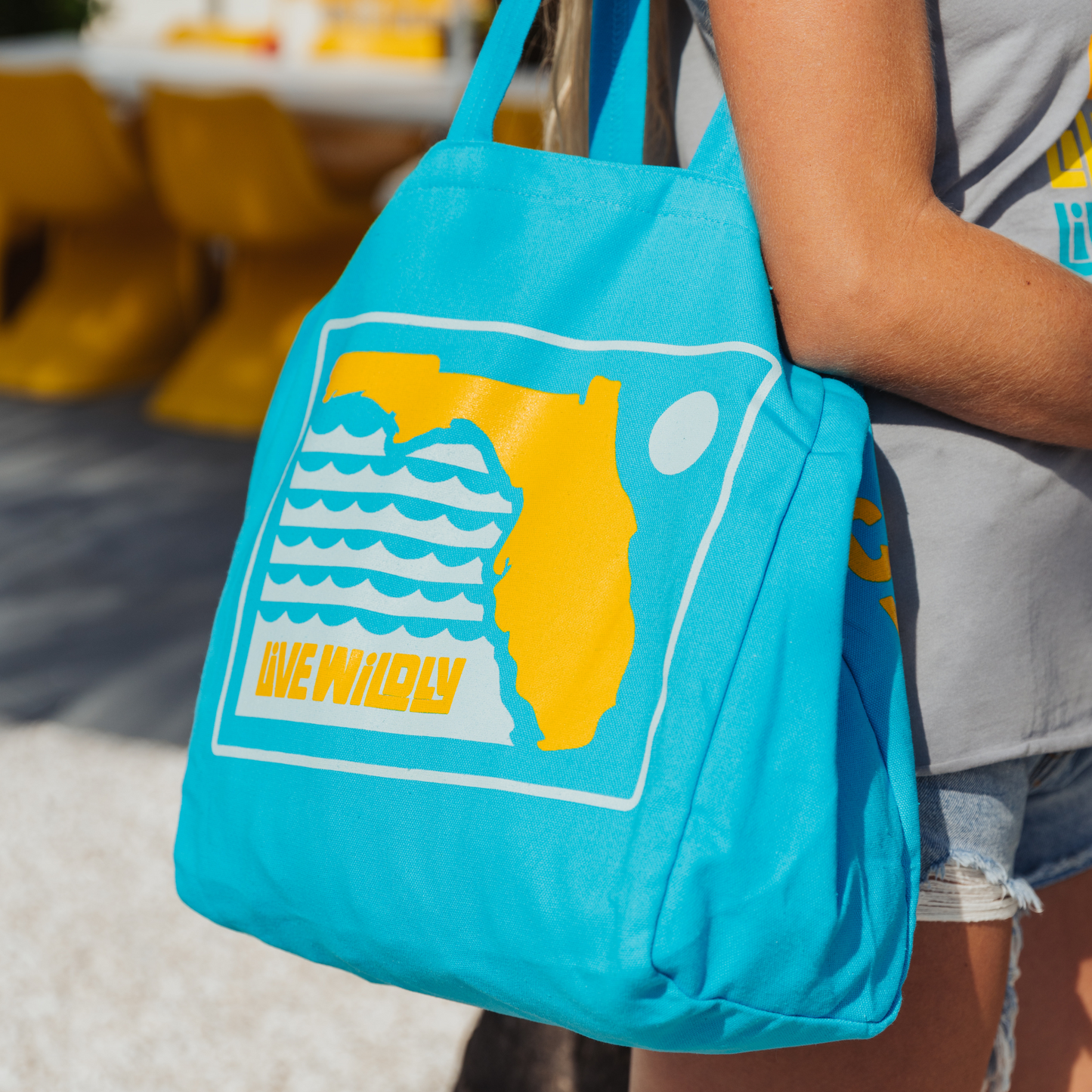 Live Wildly Florida Reusable Tote Bag – Pool Blue Canvas - Over Shoulder Zoomed - Live Wildly 