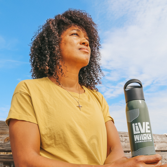 Load image into Gallery viewer, Live Wildly Recycled Water Bottle - In Travelers Hand - Army Green - Live Wildly 
