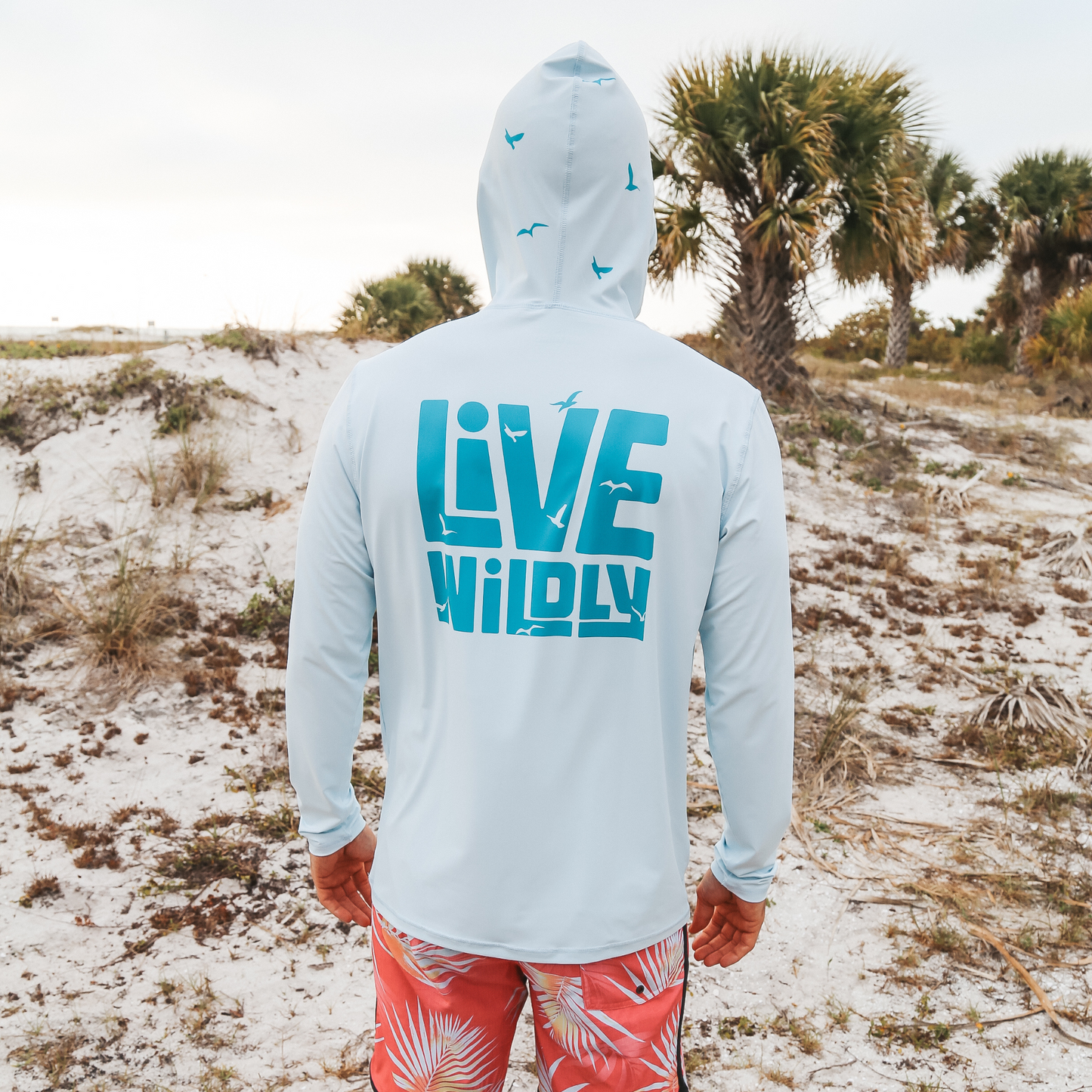 Live Wildly Unisex UPF 50+ Performance Shirt - Spring Blue - Back Displayed - Live Wildly 