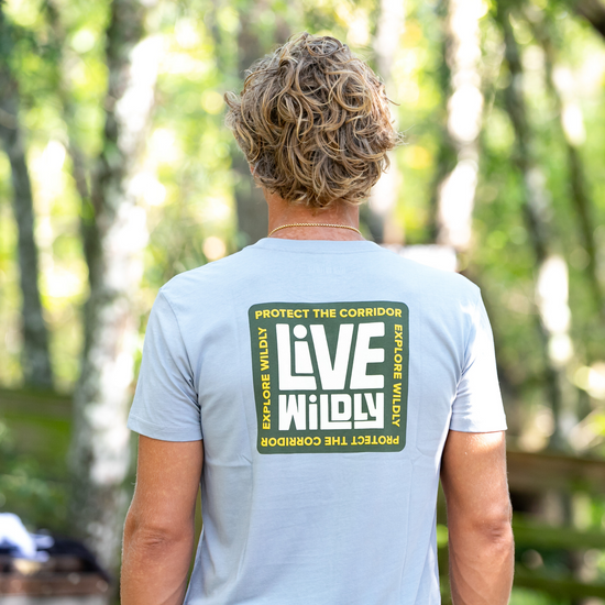 Live Wildly Unisex Tee – Grey Back - Man Wearing - Live Wildly 