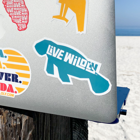 Live Wildly Manatee Sticker - On Laptop - Live Wildly 